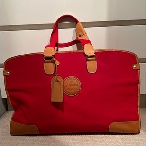 Red Lancel Weekender Bag.